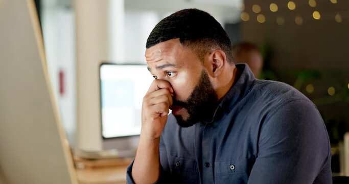 Tired, night and a businessman with a computer problem, glitch or stress about deadline at work. Anxiety, depressed and a frustrated corporate worker reading bad news on a pc during overtime