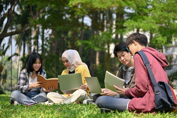Fototapeta premium A group of smart young Asian-diverse college students are discussing on their school project