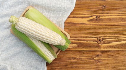White corn on a wooden table.