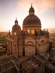 Vertical aerial of Rotunda St. John Baptist Church in Xewkija, Malta at sunset