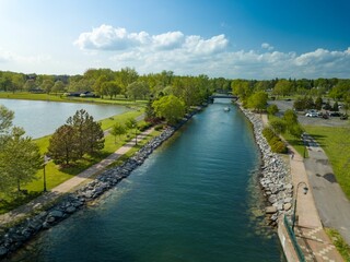 Aerial view of the river and greenery of Emerson park before the blue skyline