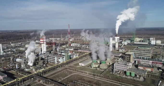 Chemistry Factory in Lithuania, Achema in Jonava City. Clear Blue Sky and Smoke Stacks in Background. Drone