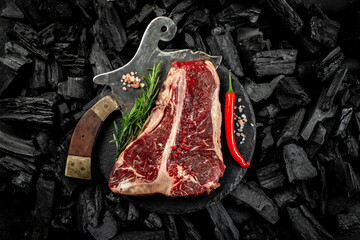 marbled beef T-bone or porterhouse beef meat Steak on BBQ grill coal. Fresh meat for grilling....