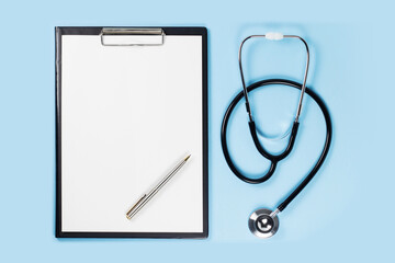 Blank clipboard with stethoscope on blue background