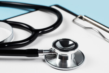 Stethoscope laying on patient information blank.