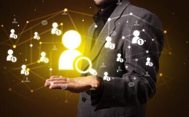 Hand holding social media icons