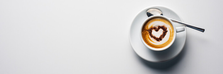 top view coffee cup with heart shape decoration. on white background. banners