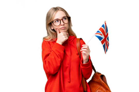 Young hispanic woman holding an United Kingdom flag over isolated background having doubts