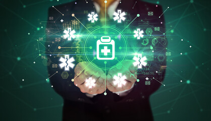 Fototapeta premium Hand holding healthcare icons concept