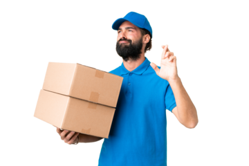 Delivery caucasian man over isolated chroma key background with fingers crossing and wishing the best