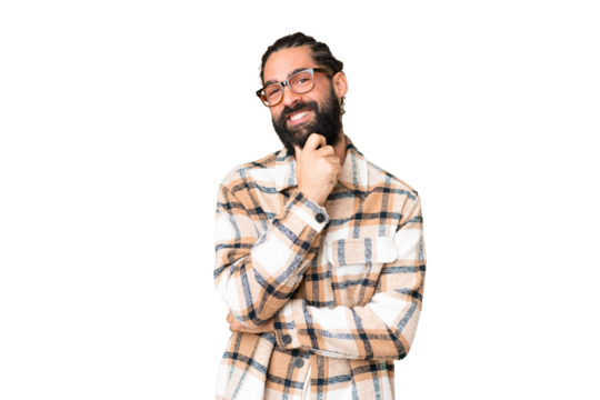 Young man with beard over isolated chroma key background with glasses and smiling