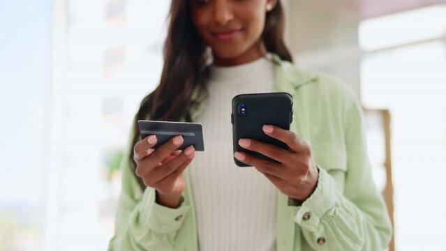 Woman, hands and phone with credit card for online shopping, ecommerce or purchase at home. Hand of female shopper for electronic transaction on mobile smartphone bank app or internet banking indoors