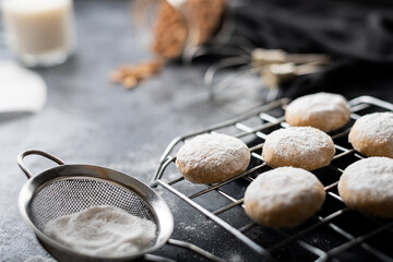 Traditional arabian cookies (kahk) sprinkled with white sugar and it's ingredients (flour, milk,...