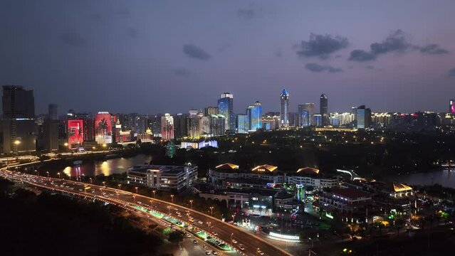view of modern cityscape of haikou at night