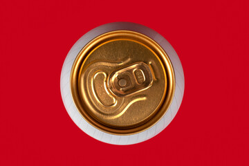 yellow beer can on red background, view from the top