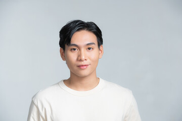 Closeup portrait of asia middle age 20s man wearing white shirt in studio