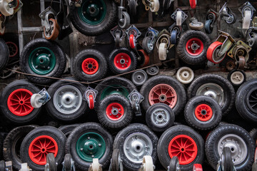 Wheelbarrow wheels of different sizes. Wheels of different colors and sizes. Karakoy hardware market. 