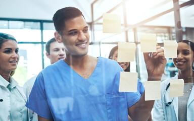 Doctor, writing and meeting in planning, brainstorming or schedule of team coaching on glass board...
