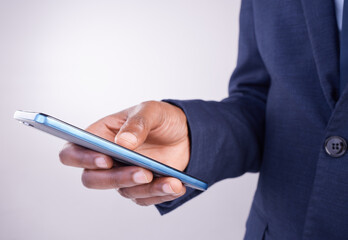 Hands, man and smartphone texting in white background for business app, planning and internet search. Closeup male, mobile typing and studio connection on technology, corporate networking and contact