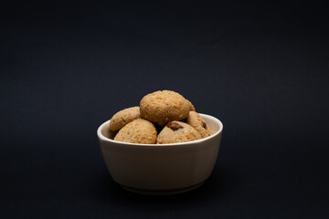 A  bowl full of plain Kahk with no sugar (traditional Arabian cookies), celebration feast after Ramadan, holy month
