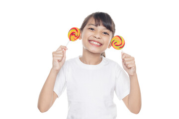 Young Asian girl smiles and holding lollipop candy isolated on white background with clipping path.