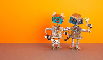 Two handyman mechanic robots with adjustable wrench, hand wrench tools on orange brown background....