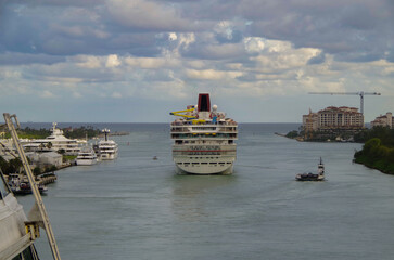 Fun cruiseship cruise ship liner Sensation departure from Miami port with canal and South Beach...