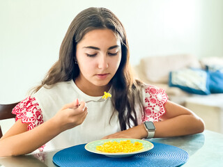 girl eating scrambled eggs