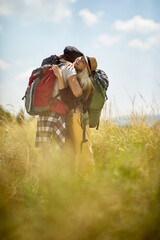 Loving embracing man and woman  having fun in the nature..Holidays, vacation and friendship concept.