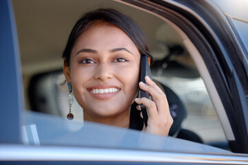 Travel, phone call and woman in car, happiness and communication on journey, smile and relax. Female traveler, happy girl and commuter with smartphone, connection and talking in vehicle and transport