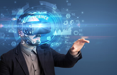 Businessman looking through VR glasses