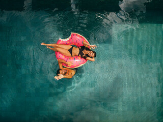 Couple enjoying vacation in resort pool