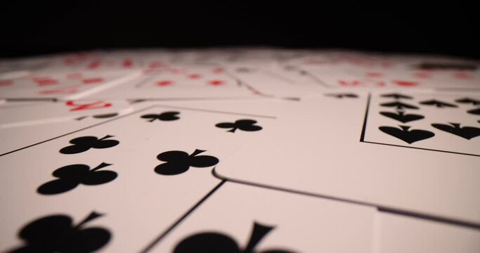 Combination of poker casino playing cards. Isolated on black poker table background