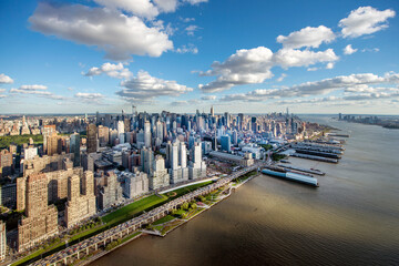 elevated view over the River Hudson and New York city waterside bathed in low sunshine