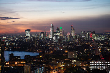 night view of the city of London with illuminated buildings