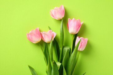 Bouquet of pink tulips on green background. Happy Mothers Day, Birthday, anniversary concept.