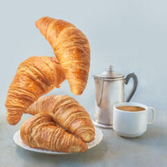 Flying croissants on gray background