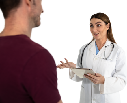 Female caucasian doctor holding digital tablet talking to male patient against black background
