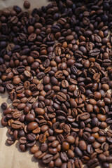 Coffee beans on brown paper background, can be used as a background