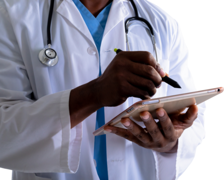 Mid section of african american male doctor using graphic tablet against white background