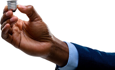 Close up of hand of businessman holding a bulb screw base against white background