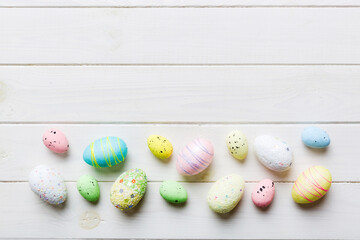 decorative easter eggs on colored background. easter eggs collection top view with copy space