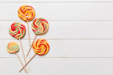 Set of colorful lollipops on colored background. Summer concept. Party Happy Birthday or Minimalist...
