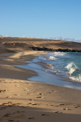 Fototapeta na wymiar Sandy beach of Atlantic ocean, Fuerteventura, Spain