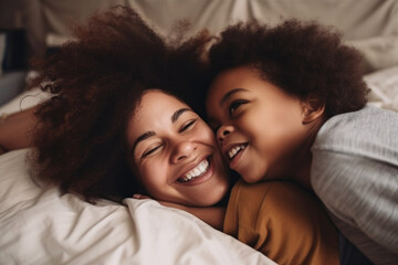 Fototapeta na wymiar Family, love and black woman with boy or child lying in bed in a home smiling and bonding by having fun. Top, mother and son in a house with her mother, face and happiness in a bedroom. Generative ai