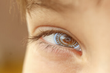 Close-up of a male eye with visual effects. The concept of a sensor implanted in the human eye....