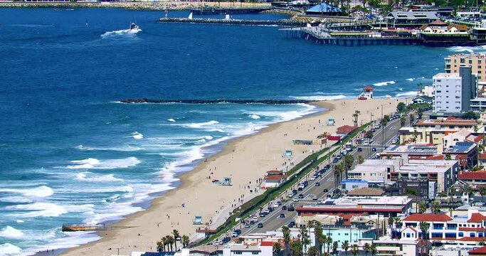 Aerial panorama of Hermosa Beach, Redondo Beach, Manhattan Beach, Pacific Ocean and snow mountains in Los Angeles, California, 4K