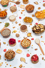 
Healthy vegetarian food concept. Assortment of dried fruits, nuts and seeds on white background. Top view.
