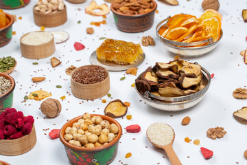 
Healthy vegetarian food concept. Assortment of dried fruits, nuts and seeds on white background. Top view.

