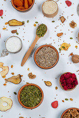 
Healthy vegetarian food concept. Assortment of dried fruits, nuts and seeds on white background. Top view.
